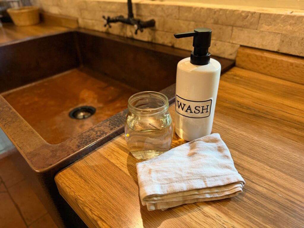 Mild soap, soft cloth and gentle tools for copper sink care