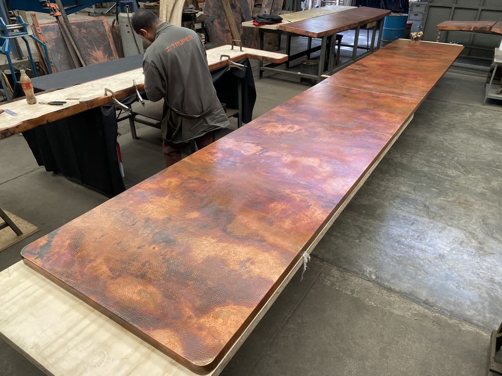 Handcrafted copper surface with controlled hammered texture for Sierra Restaurant